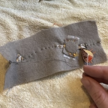 Testing the conductivity on the front of a pin, its not conductive. possibly could use the backing post somehow for the non wearable circuit?