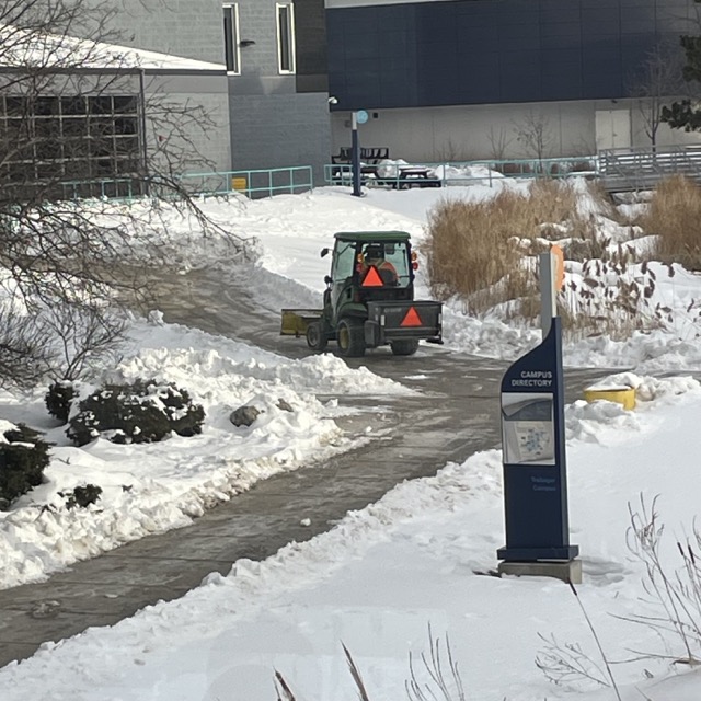 a small snowplow driving around sheridan campus. I thought the engine whirring was intresting