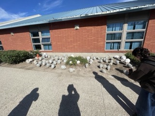 a place from the spacial workshop 1 exploration. this is a garden of heads outside the annie smith building. they may have been made by ceramics? I am not sure